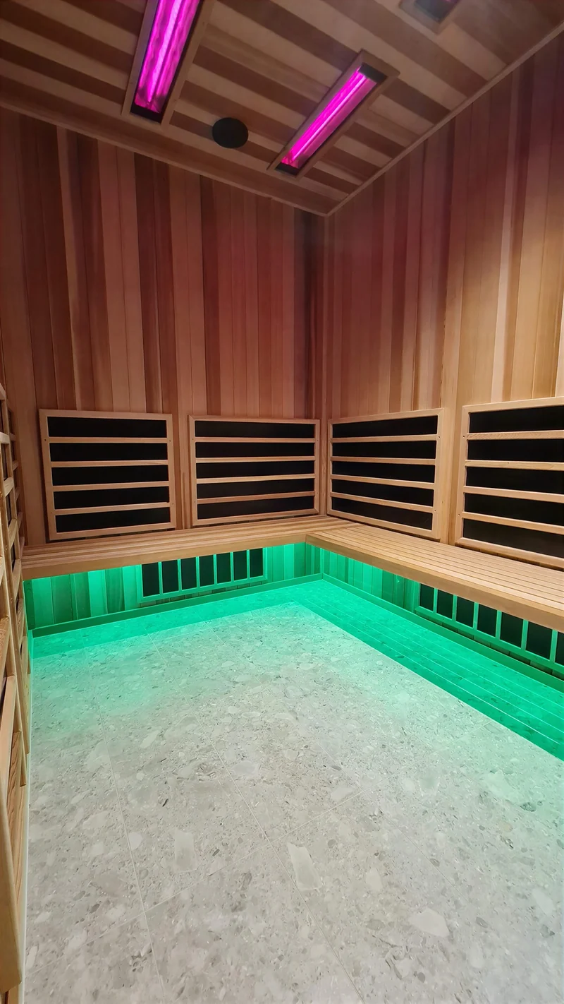 Infrared sauna cabin lit with a green accent light